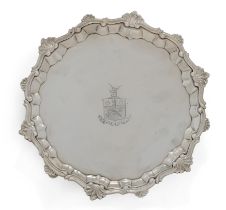 A George II silver salver.  William Peaston,  London, 1748.  Of circular form with a shell and...