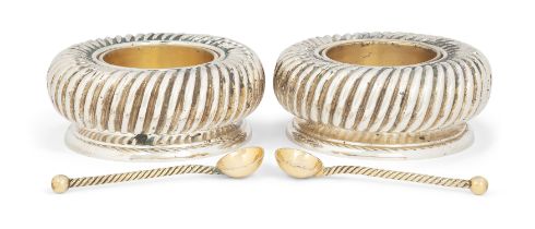 A pair of lobed parcel gilt silver salts.  Asprey & Co.,  London, 1993.  Of circular form with...