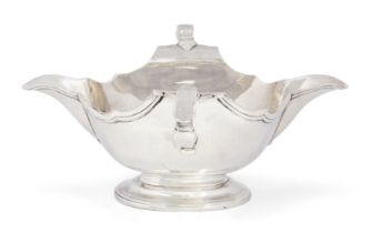 A Georgian double-lipped sauce boat.  Unmarked.  Probably c.1730.  Raised on a stepped and mou...