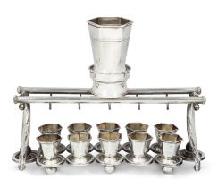 A Kiddush fountain with ten cups.  Stamped 925.    The rectangular stand supporting ten hexagon...