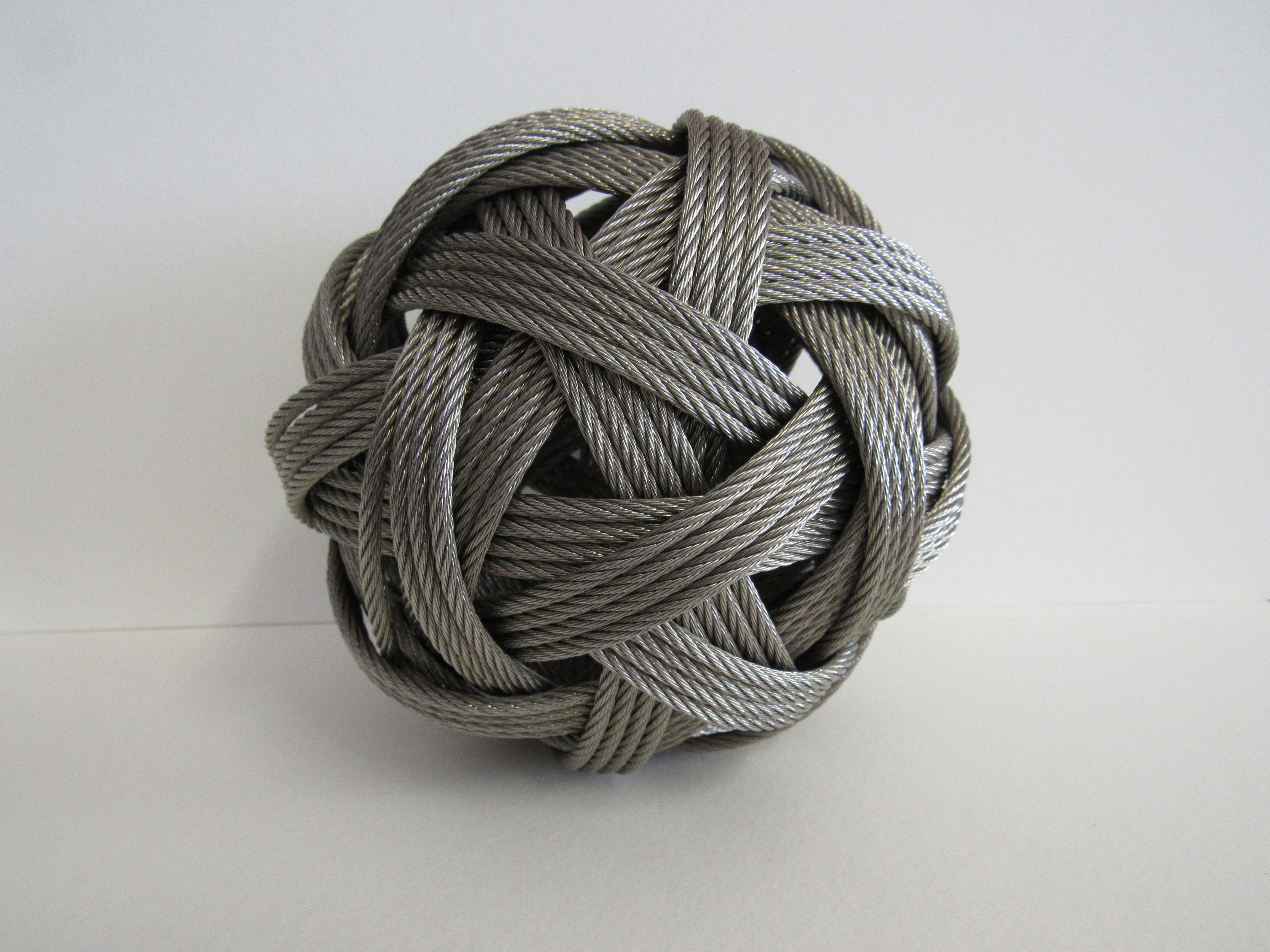 Dail Behennah,  British b. 1953 -  Woven ball;  steel wire, H16 x W16 x D16 cm (ARR) Provenanc...