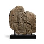 An Egyptian fragmentary relief with the bust of a god or king, Ptolemaic Period, circa 300-30 B....