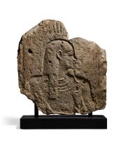 An Egyptian fragmentary relief with the bust of a god or king, Ptolemaic Period, circa 300-30 B....