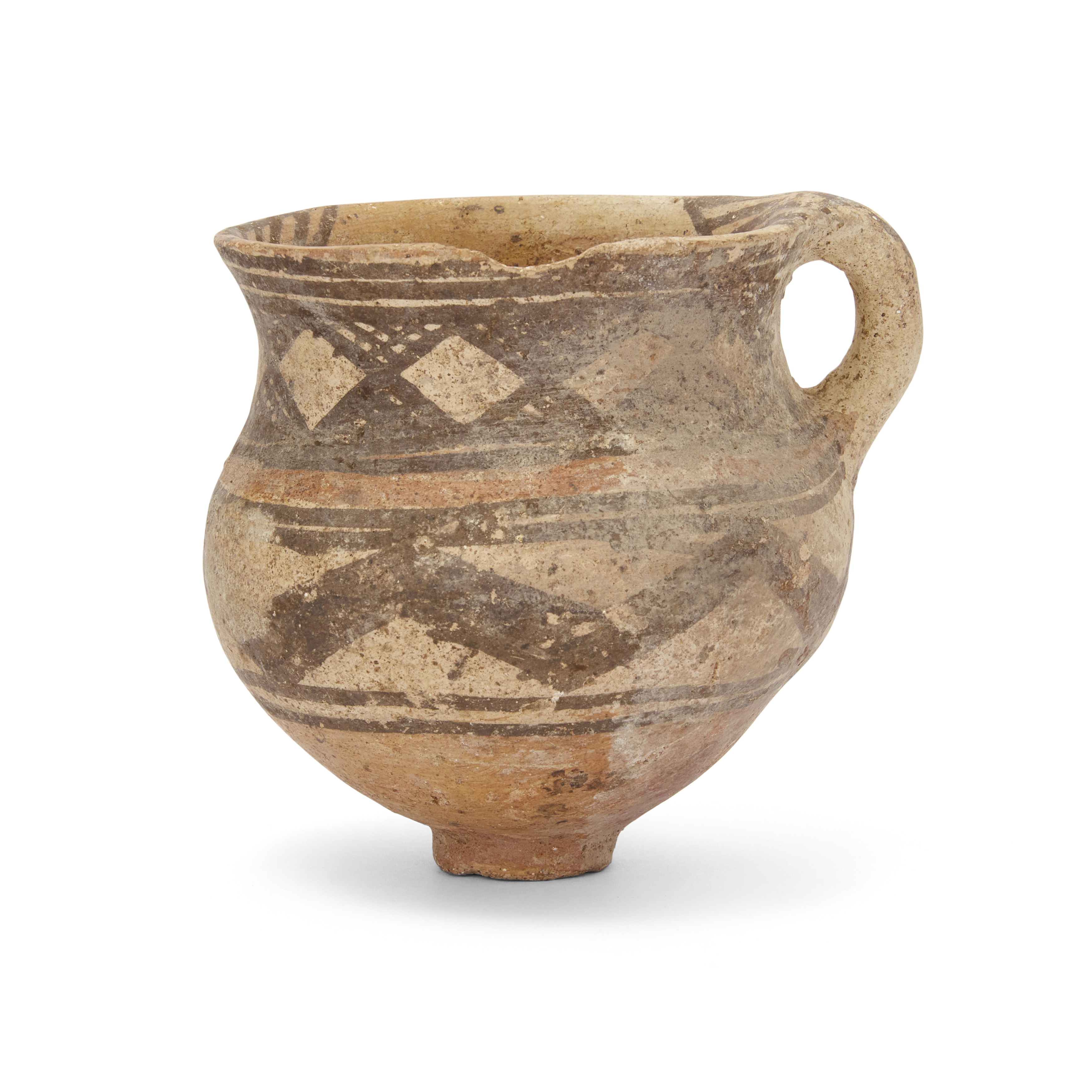 An intact buff pottery cup with ring handle, North Iran, Circa early-late 2nd Millennium B.C., ...