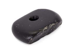 To Be Sold With No Reserve A polished oval black stone, Not Ancient, with a deep circular shaf...