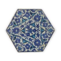 An Iznik hexagonal pottery tile, Ottoman Turkey, 1520-30, Decorated with a radial design of pal...