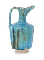 To Be Sold With No Reserve A turquoise blue glazed ewer Central Iran, 12th century On short st...