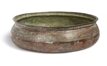 A large engraved tinned-copper bowl, Egypt or Turkey, 19th century, Of squat rounded shape, the...