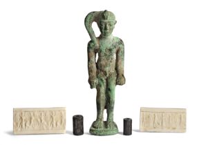 Two ancient near Eastern seals and an Egyptian bronze figure of Horus, the seals possibly re-cut...