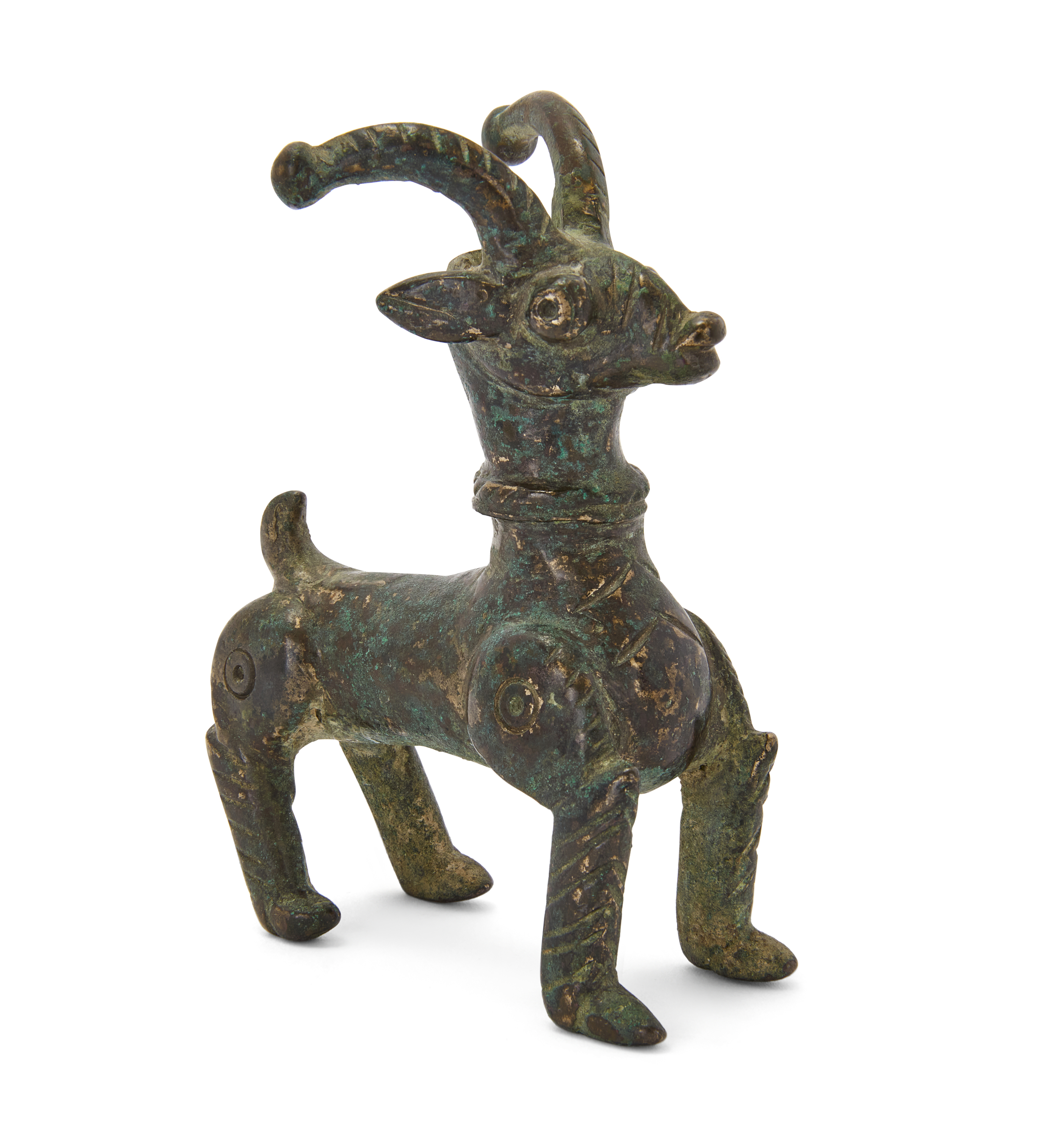 A small copper alloy figure of a deer, Khorasan, northeast Iran, 12th century, Its antlers and ...