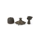 A bronze lampstand base, a bronze inkwell and a silver-inlaid oil lamp,  Khorasan, North East Ir...