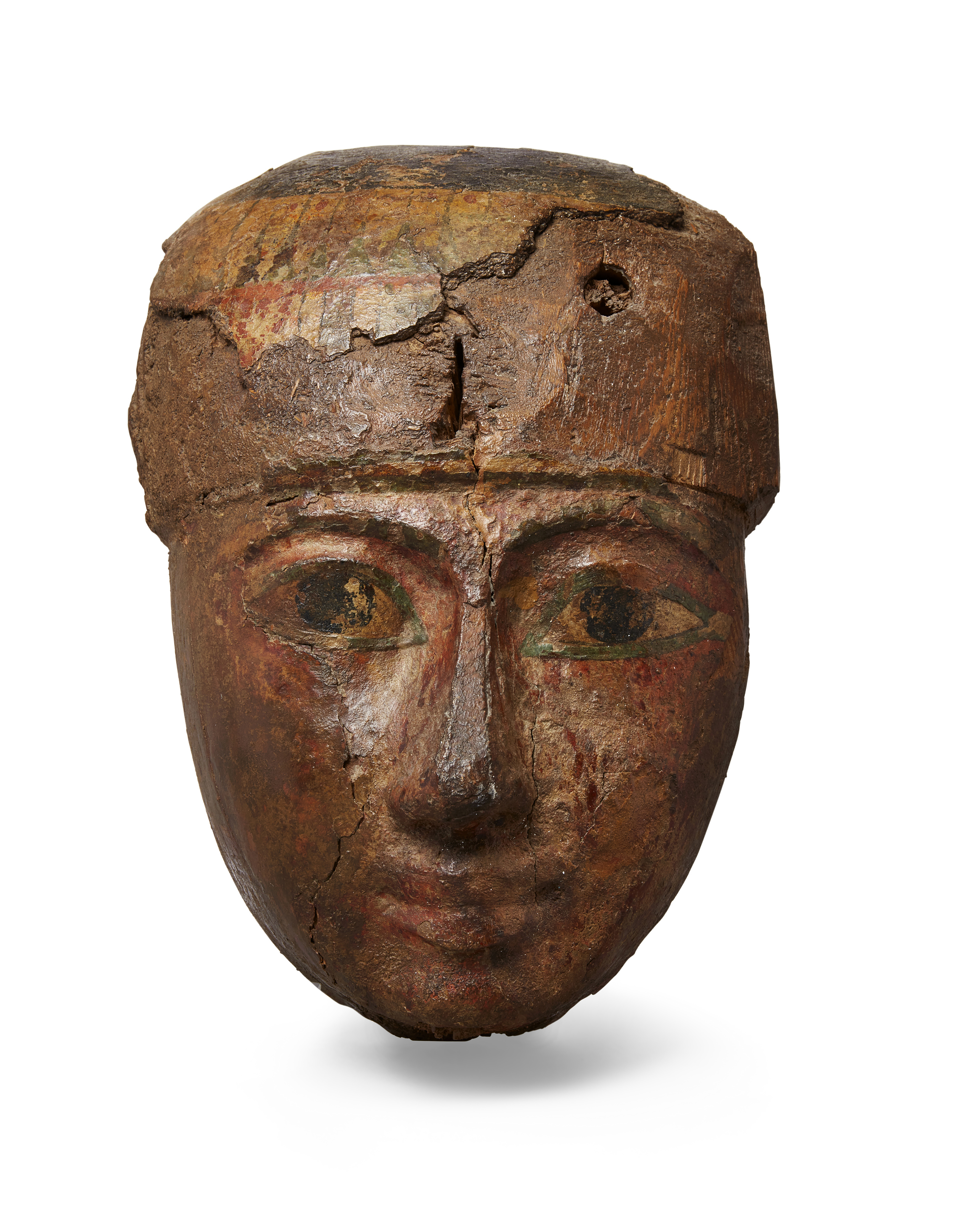 An Egyptian polychrome painted wood coffin mask, Third Intermediate Period, circa 1069-715 B.C.,...