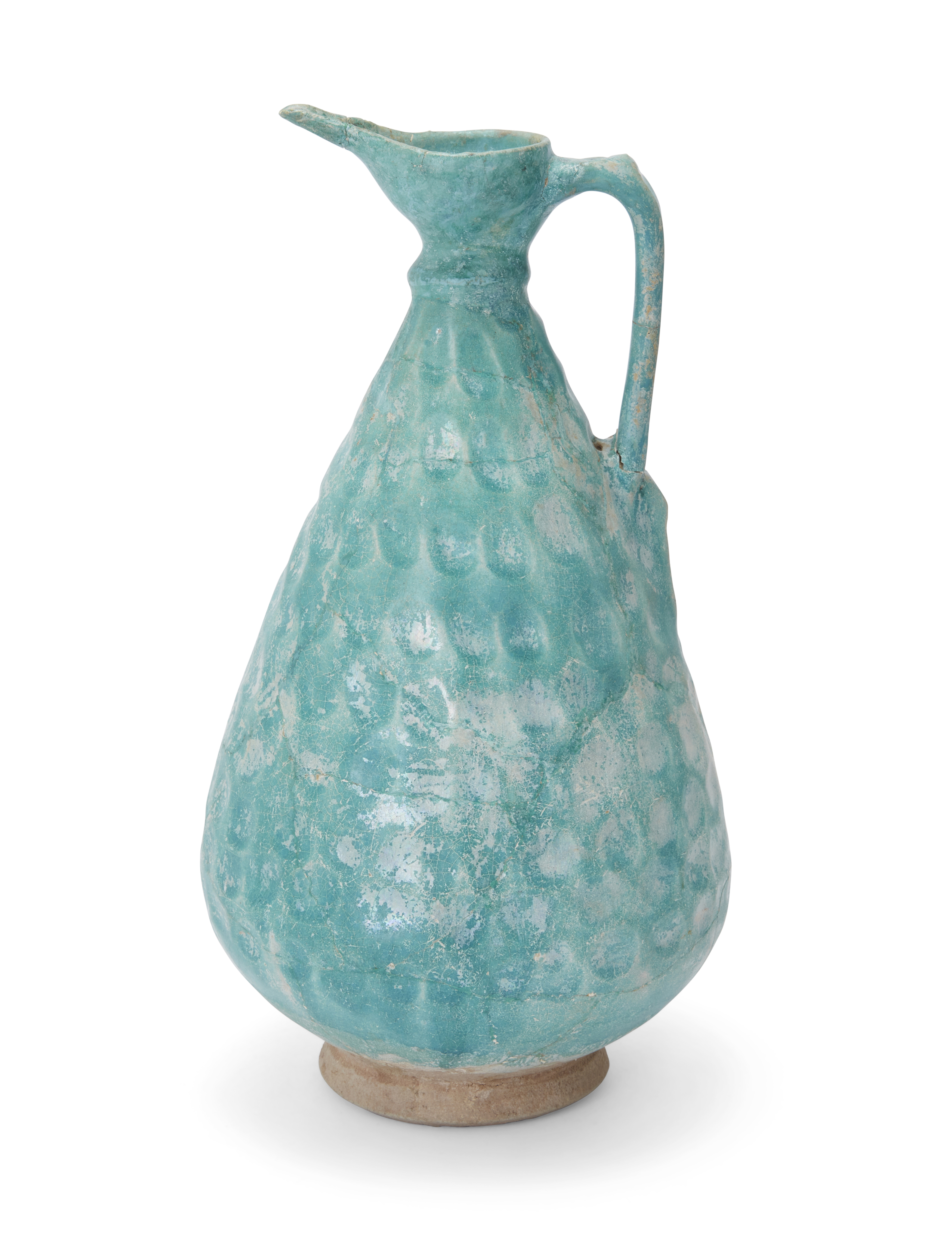 A turquoise blue-glazed pottery footed jug, Kashan, Central Iran, 12th century, of drop-shaped ... - Image 2 of 2