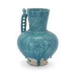 To Be Sold With No Reserve An incised turquoise blue glazed globular pottery jug with felines, ...