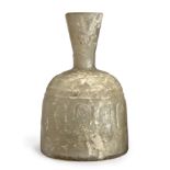 To Be Sold With No Reserve A clear glass wheel cut mallet bottle, 10th century A.D., On plain ...