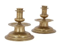 Two Veneto-Saracenic candlesticks, late 19th-early 20th century, Of typical form, the flanged t...