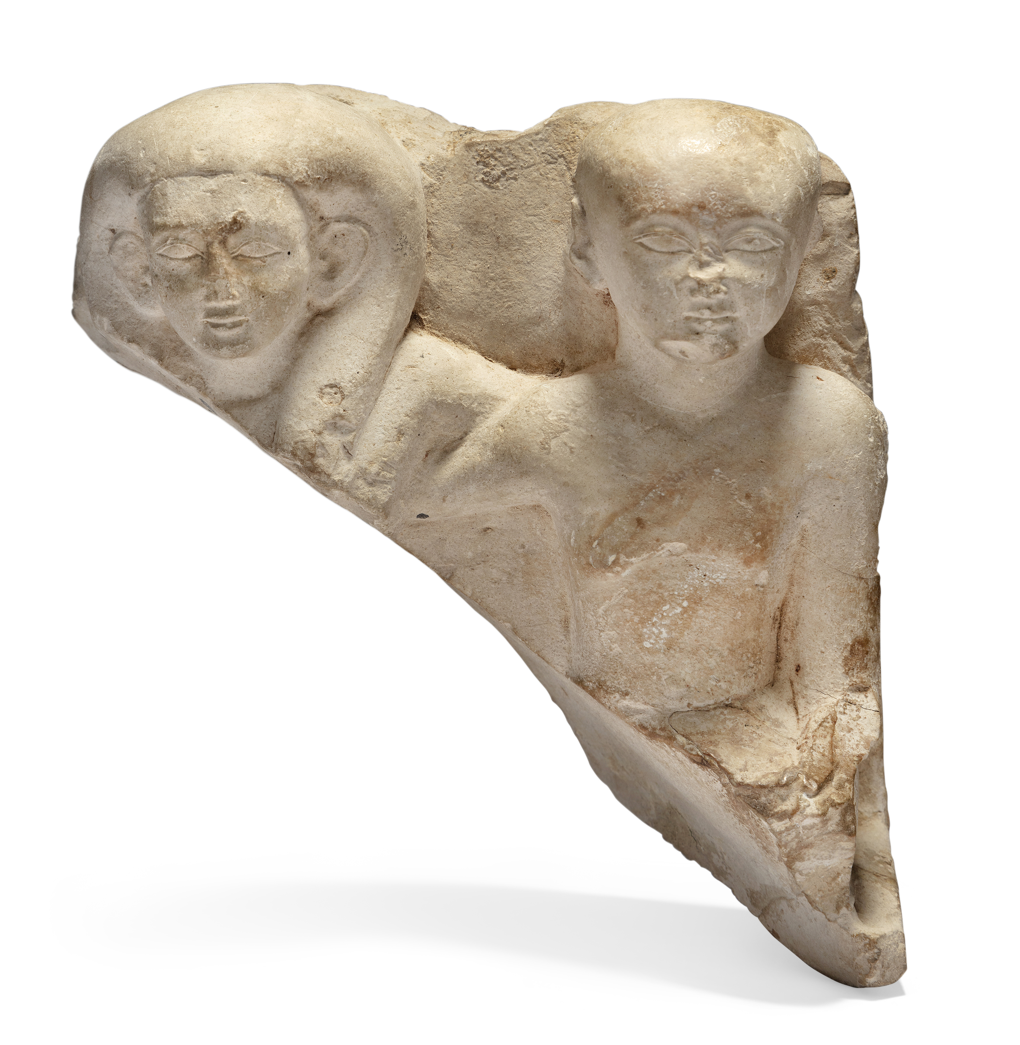 An Egyptian fragmentary limestone pair statue of a man and a woman, possibly New Kingdom, early ...