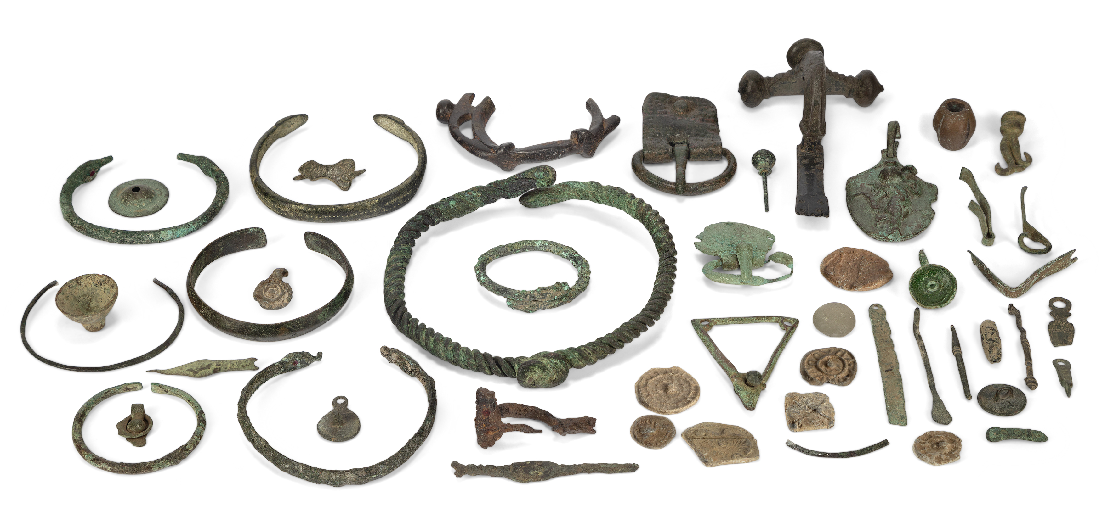 A miscellaneous group of ancient to medieval bronze and lead items, Including the escutcheon of ...
