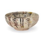 A Nishapur yellow, green and black painted pottery bowl, Central Asia, 11th century, On short f...