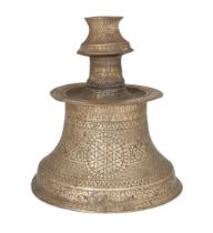 To Be Sold With No Reserve An engraved silver-inlaid brass candlestand, possibly Turkish provinc...