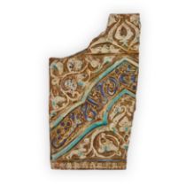 A fragmentary calligraphic cobalt and turquoise blue and lustre pottery tile Ilkhanid Iran, circ...