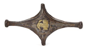 A bronze sword crossguard with brass lion, Iran, 12th-14th century, of cruciform shape, with br...