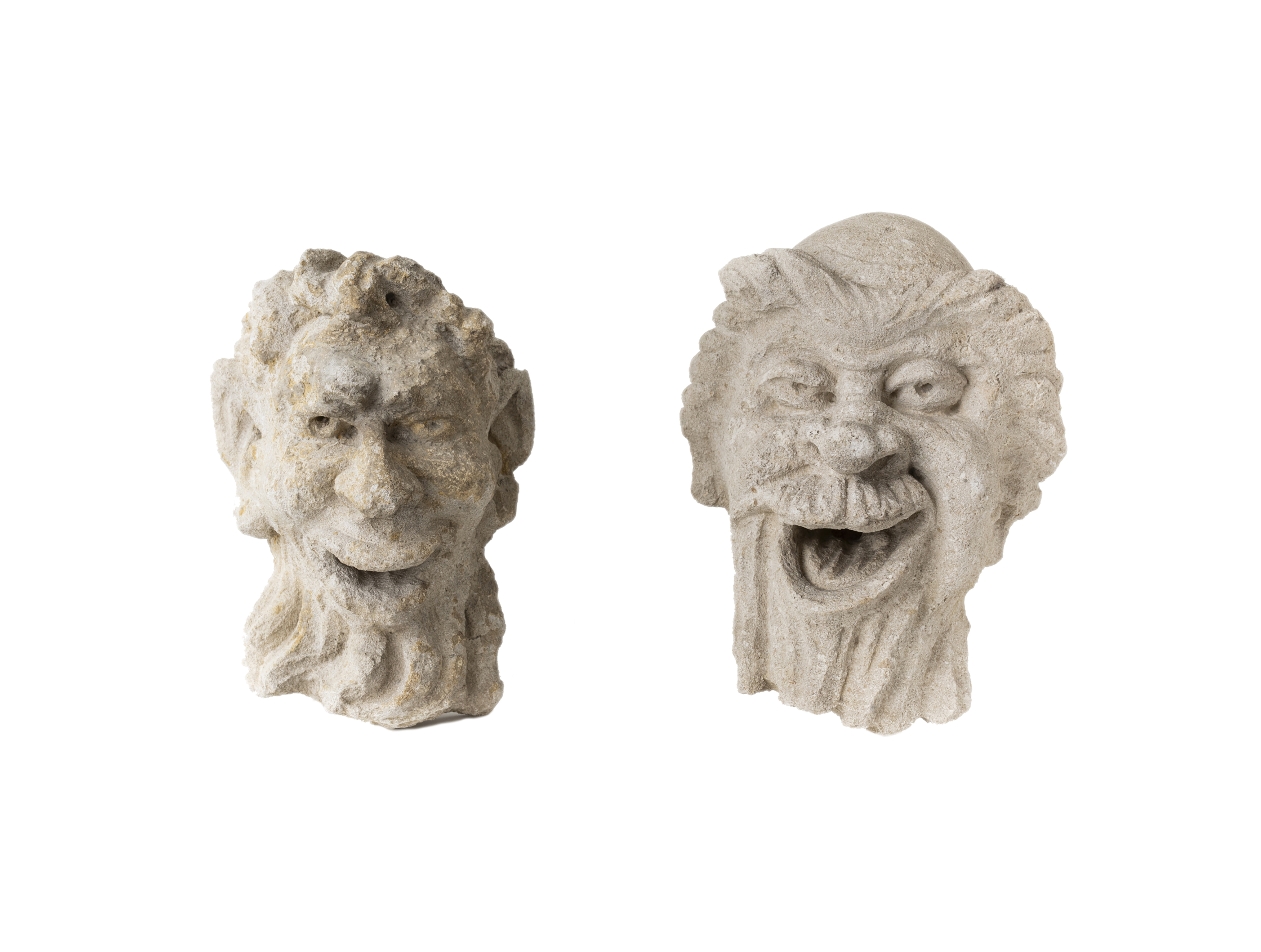 Two stucco masks of a faun, in the Hellentistic style, 19th century, Crudely carved, with long ...