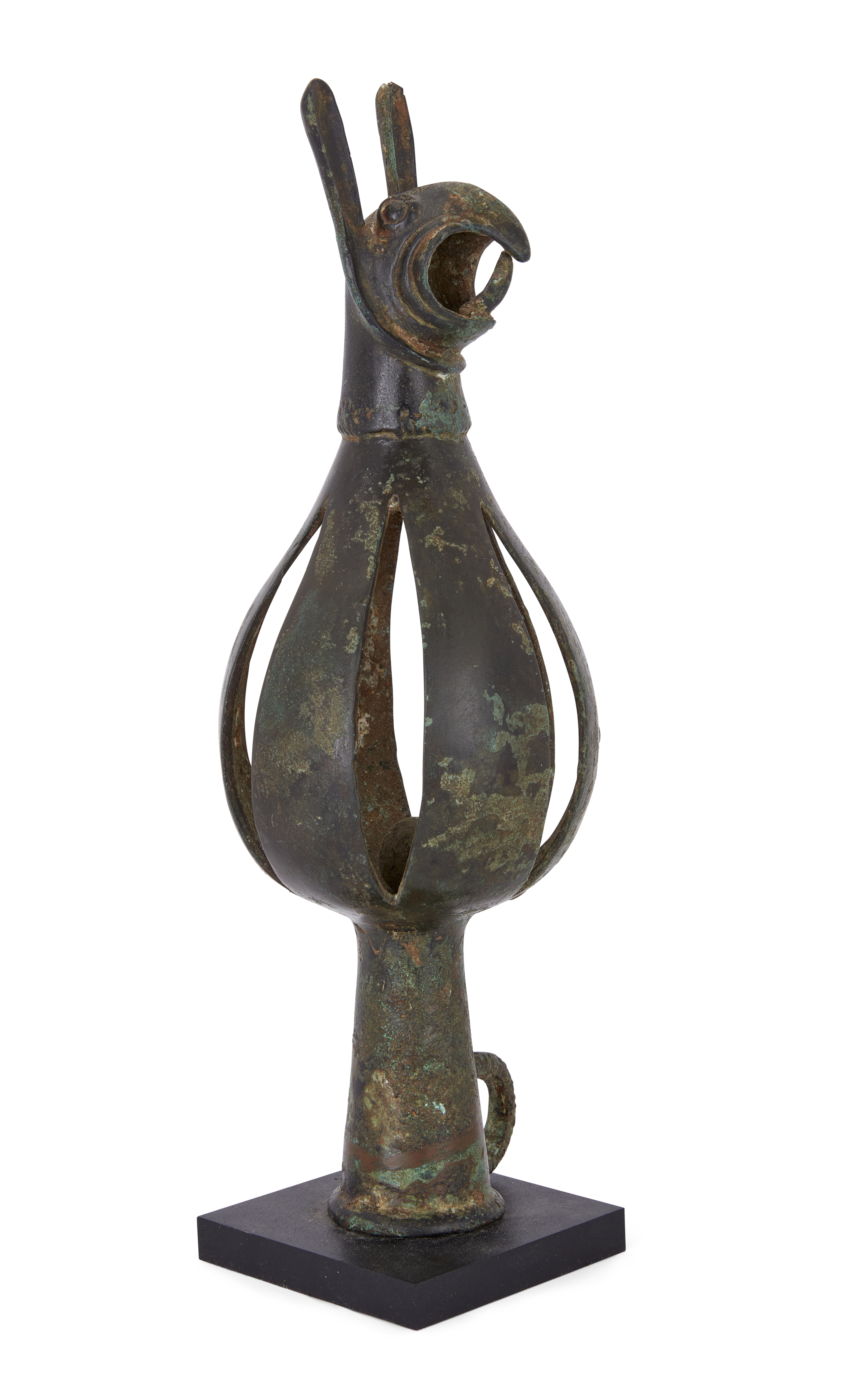 A substantial Scythian bronze terminal, circa 7th century B.C., with openwork bell, surmounted ...