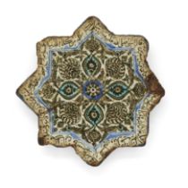 A star tile, Safavid Iran, circa 1600 Underglaze painted in black, turquoise and cobalt blue wi...