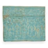 To Be Sold With No Reserve A rectangular turquoise glazed moulded pottery tile, Kashan, Iran, 1...