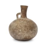 An intact Amlash grey pottery flask, North Iran, late 2nd – mid 1st Millennium B.C. of globular...