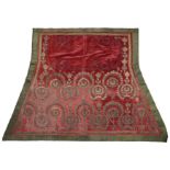 A silver thread embroidered red velvet saddle mat, Bukhara, first half 19th century, rows of ar...