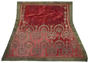 A silver thread embroidered red velvet saddle mat, Bukhara, first half 19th century, rows of ar...