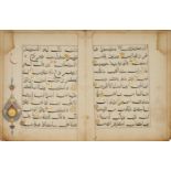 A detached Qur'an bifolio India, circa 16th century Arabic manuscript on paper, 11ll. of black ...