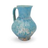 To Be Sold With No Reserve A grooved turquoise blue glazed globular pottery jug, Kashan, centra...