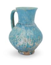 To Be Sold With No Reserve A grooved turquoise blue glazed globular pottery jug, Kashan, centra...