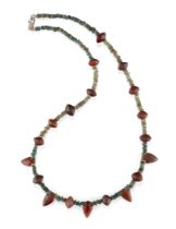 To Be Sold with No Reserve A necklace composed of ancient Egyptian faience disc beads intersper...