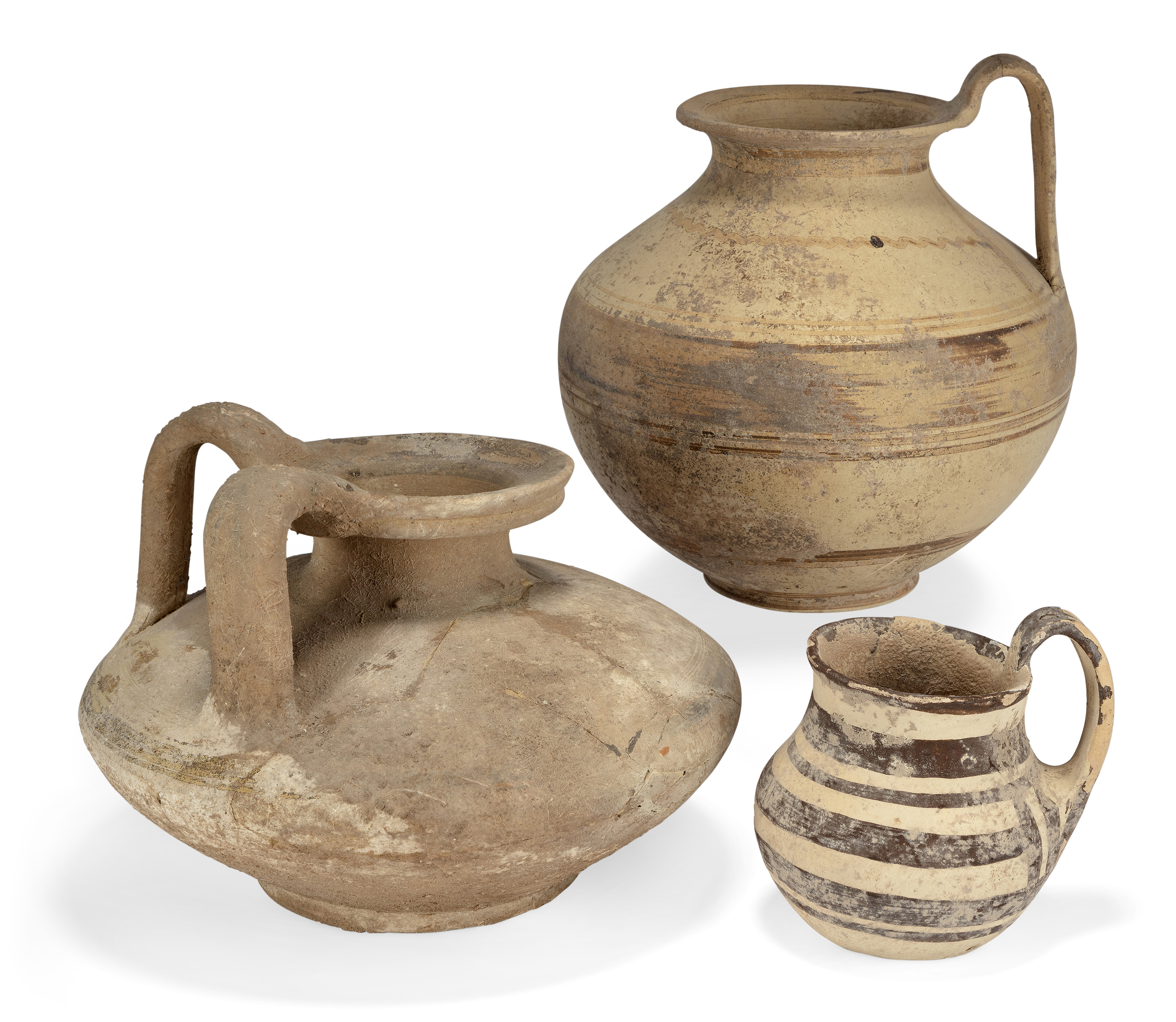 Three Greek South Italian pottery vessels, Circa 6th-5th Century B.C. Including a small handled...