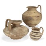 Three Greek South Italian pottery vessels, Circa 6th-5th Century B.C. Including a small handled...