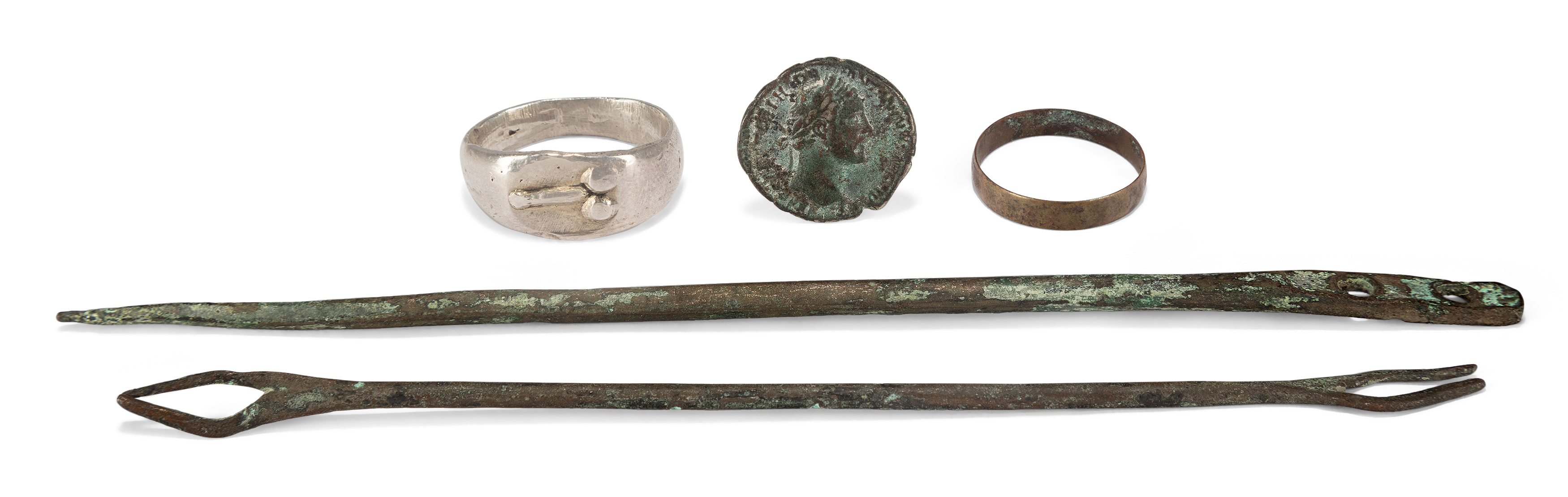 A group of Roman bronze items Comprising a Roman bronze pin, 14.5cm long; a bronze ring, 2cm dia...