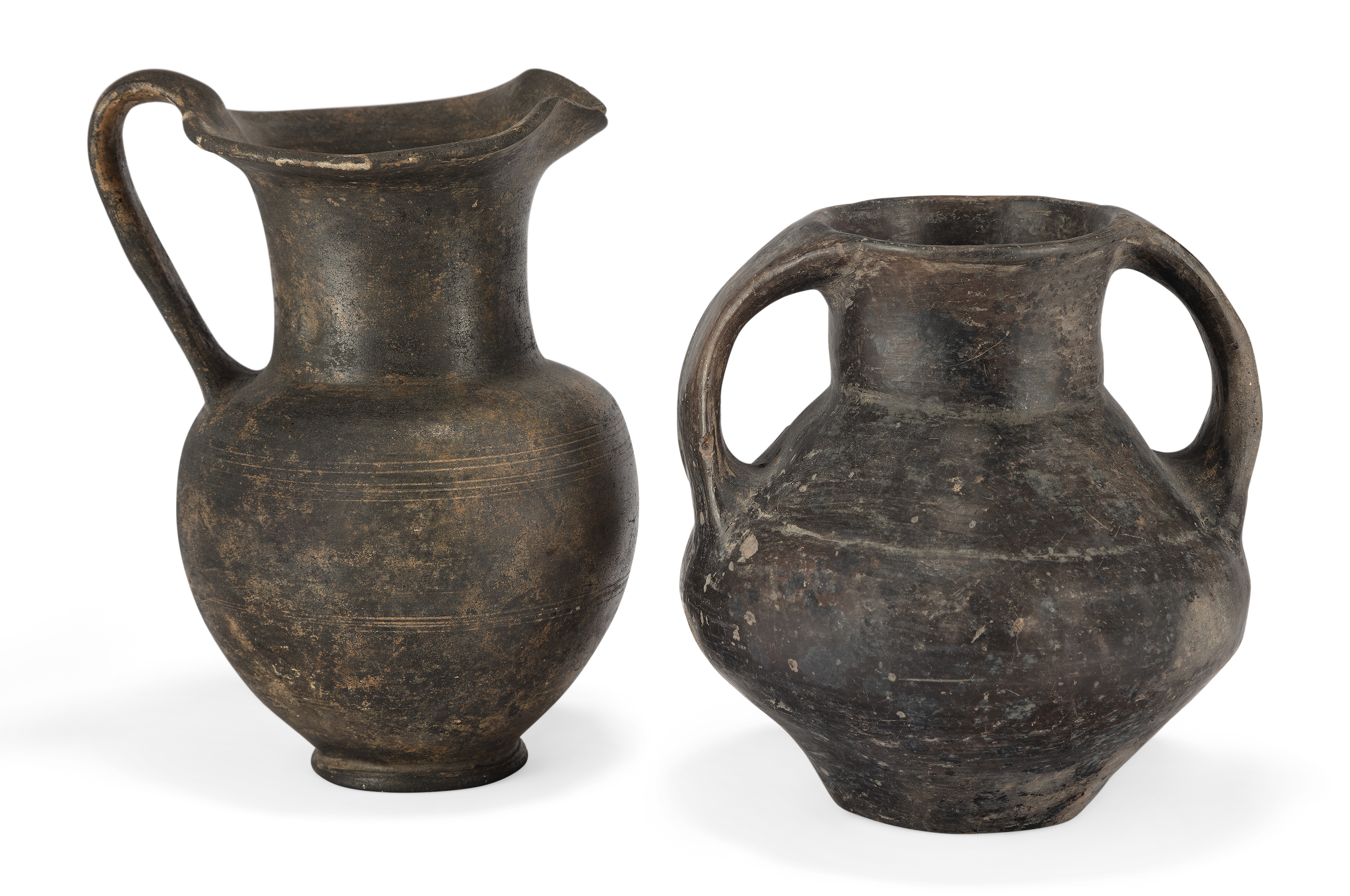 Two pottery North Italian pottery vessels, Circa 8th-6th Century B.C., One an Impasto Ware amph...