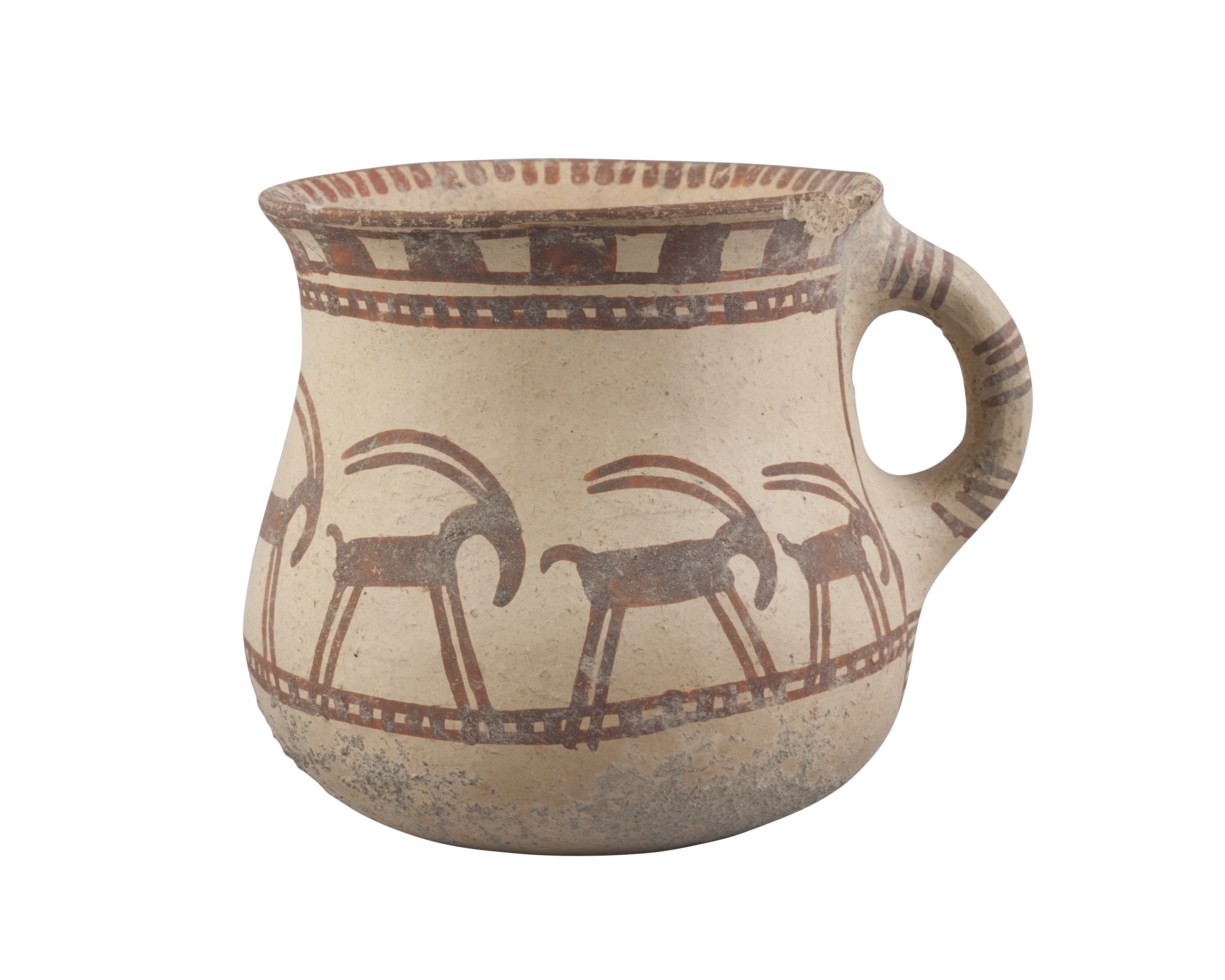 A Western Asiatic pottery handled cup, the deep bowl with rounded base and flared rim, the exter...