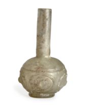 To Be Sold With No Reserve A clear glass wheel cut spherical bottle, 10th century A.D., On sho...