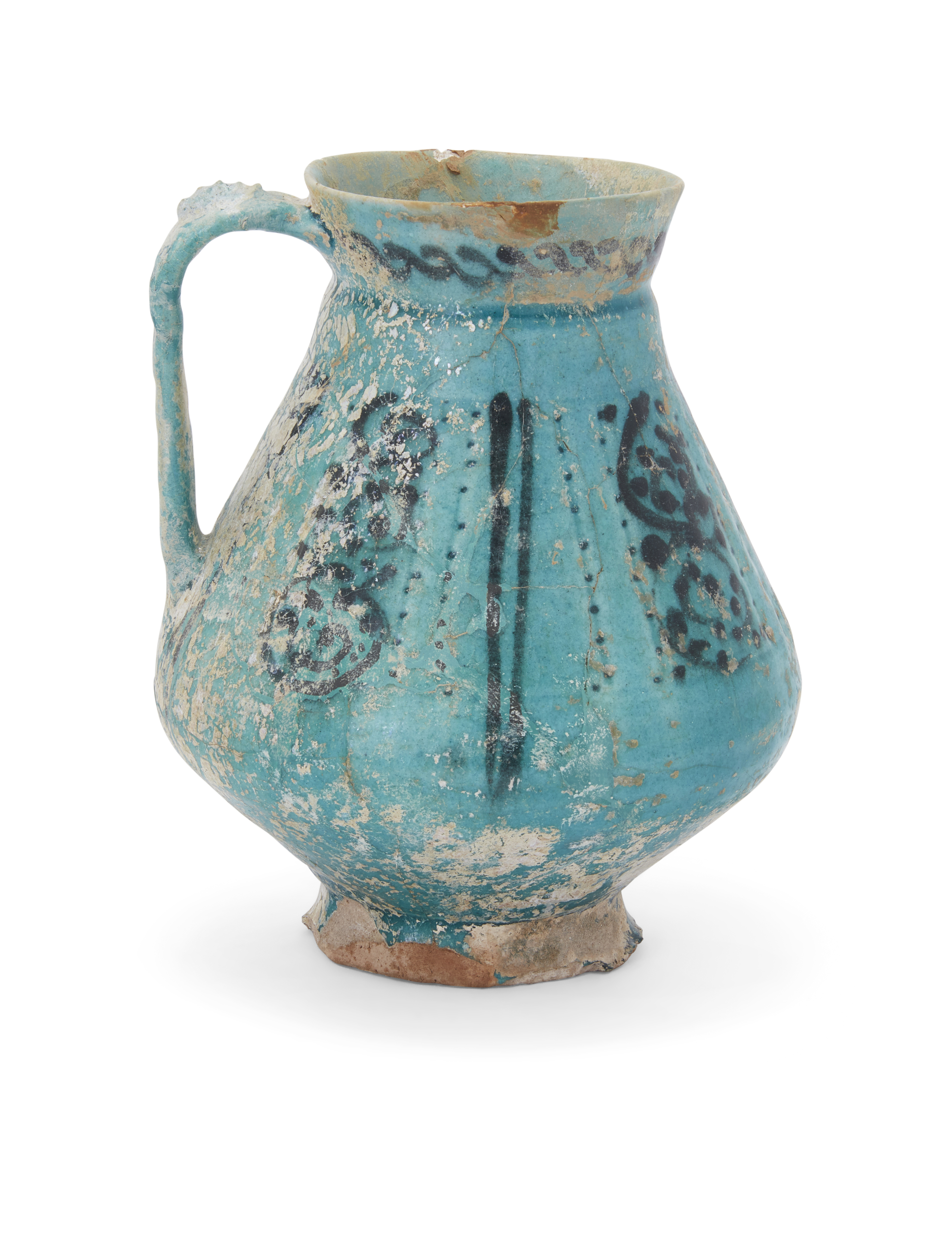 A Kashan turquoise glazed footed pottery jug,   Kashan, central Iran, 12th century, Pyriform, t...