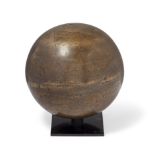 An engraved brass celestial globe, Iran, 20th century, On stand, 23.4cm. diam.