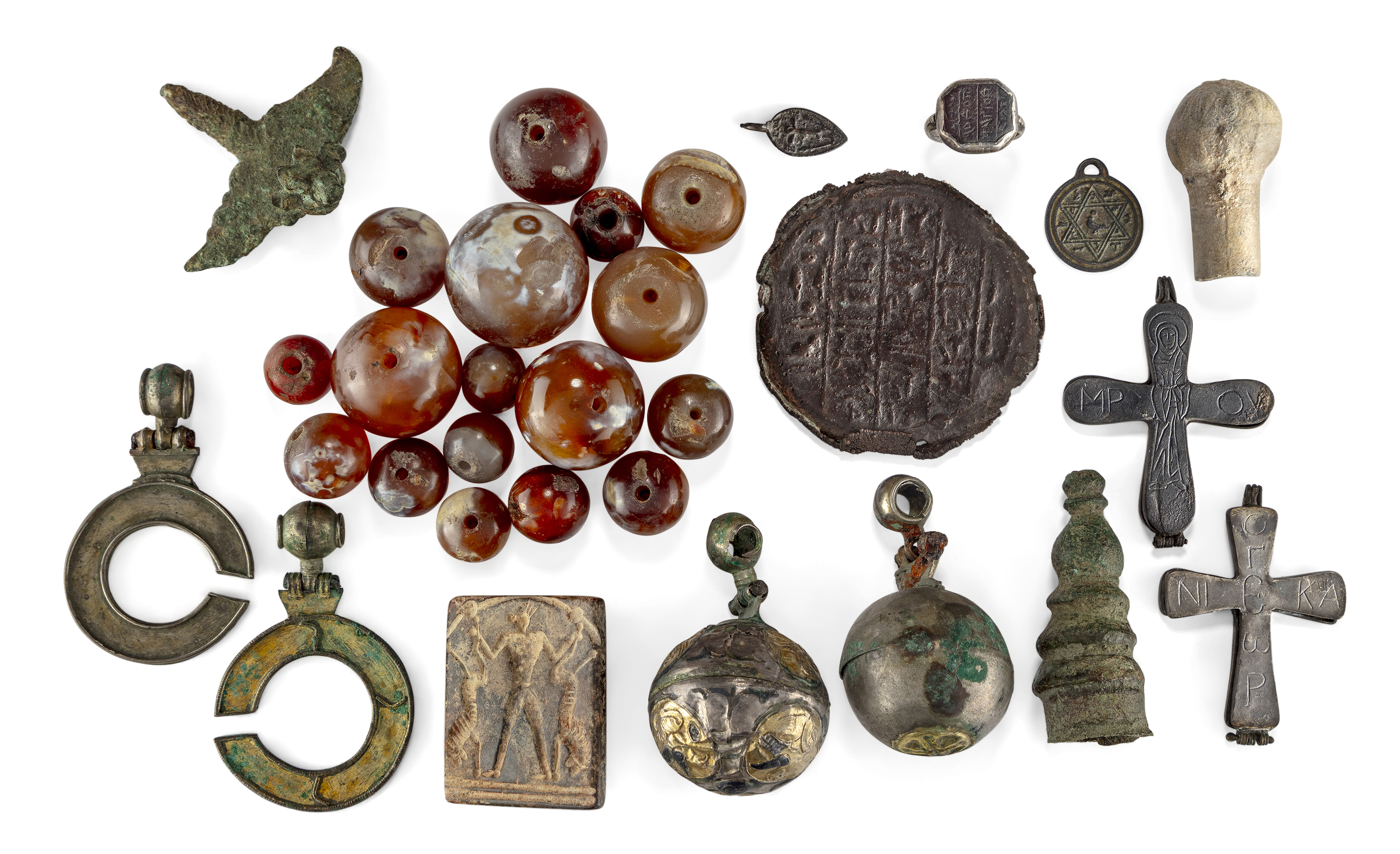A miscellaneous group of items, including 17 agate beads, Comprising a bronze mould of the end o...