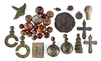 A miscellaneous group of items, including 17 agate beads, Comprising a bronze mould of the end o...