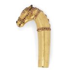 A gold overlaid steel horse head hilt, Mughal India, 18th century, Realistically cast, the mane...