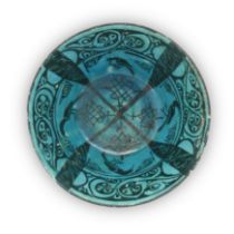 A turquoise blue glazed and black conical bowl Kashan, central Iran, 12th-13th century The blac...