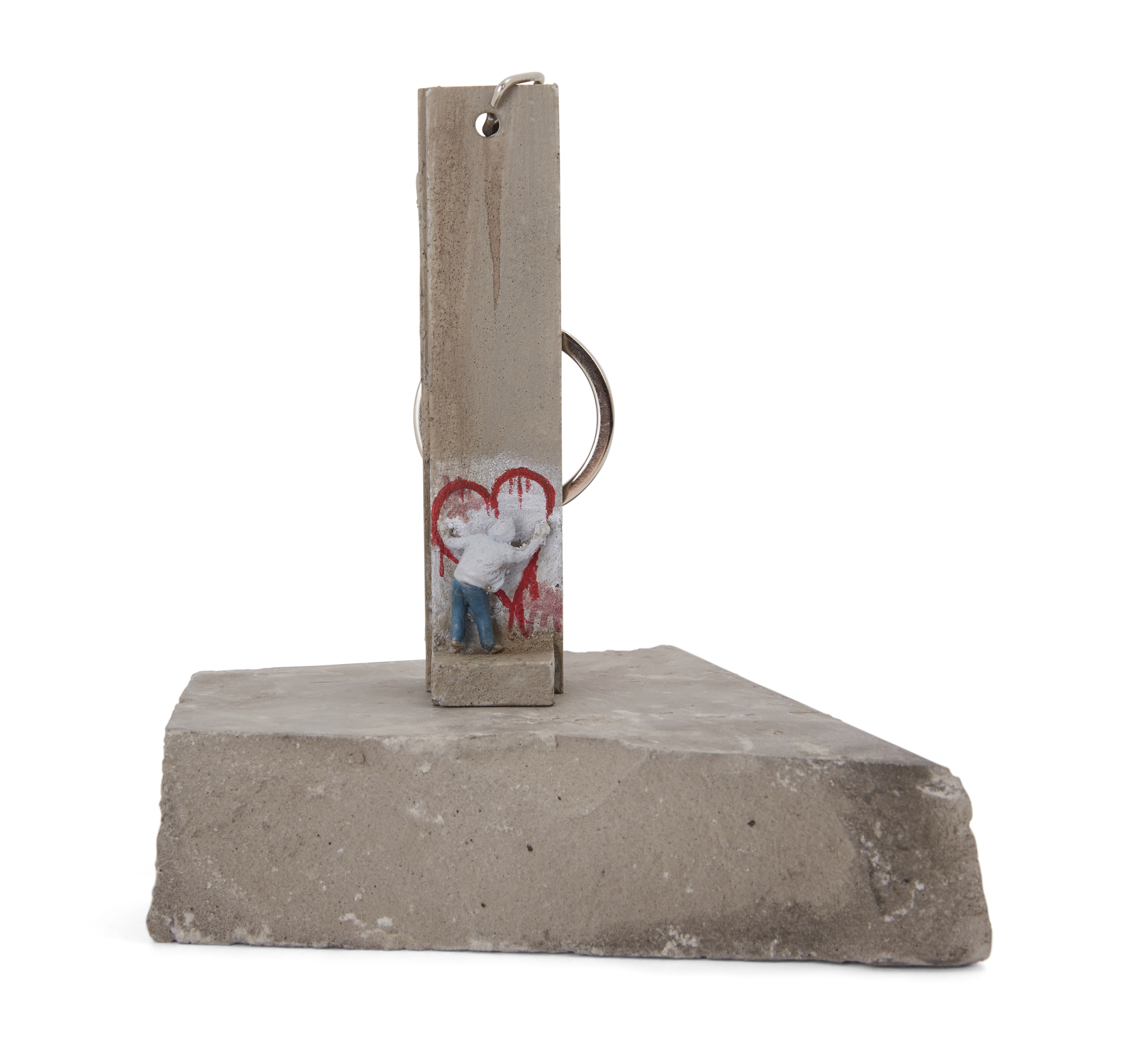 Banksy, British b. 1974- The Walled Off Hotel - Key Fob with Figure;  cast resin sculpture with...